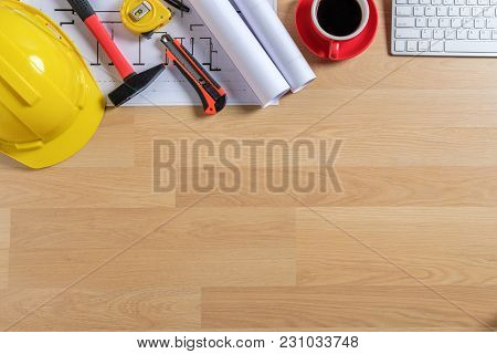 Office Desk With Computer, Cup Of Coffee And Engineer Equipment.top View With Copy Space. Background