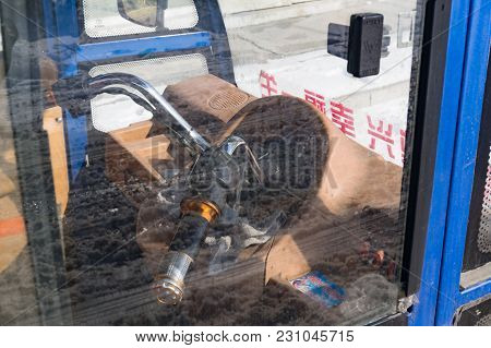 Hunchun, Jilin, China - March 8, 2018: Steering Wheel Inside Cabin Interior Three-wheel Motor Scoote