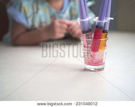 Liquid Medicine In Syringe For Sick Children