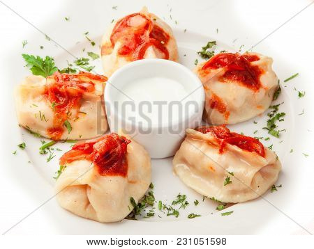 Boiled Dumplings With Sauce On Whilte Plate