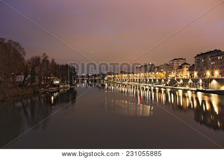 Po River Flowing In Torino City, Italy, Night View On Murazzi Docks