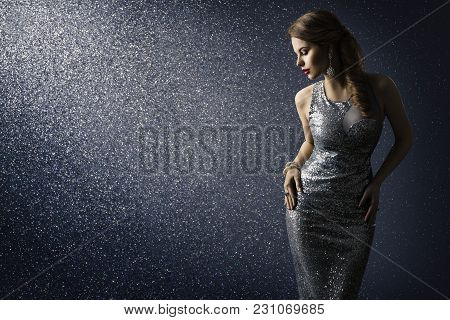 Silver Dress, Fashion Model Posing In Sparkling Sexy Gown, Elegant Woman Beauty Portrait On Lighting