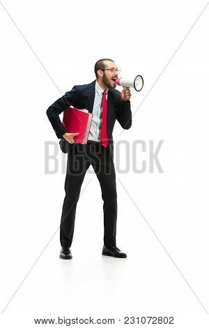 Side View Of Man Screaming On Megaphone Over White Background. Young Casual Man Shouting. Shout. Cry