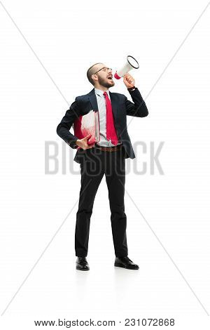 Side View Of Man Screaming On Megaphone Over White Background. Young Casual Man Shouting. Shout. Cry