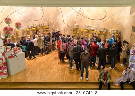 Paris, France, March 27 2017: Tourists at presentation hall of perfume of the Museum Fragonard Shop with tourists