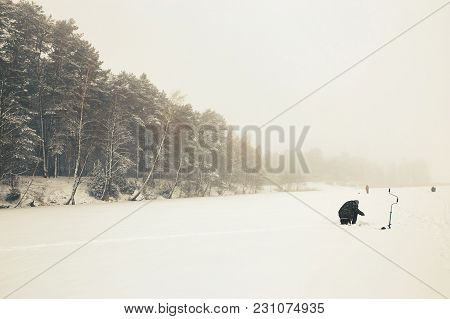 Belarus, Grodno, Molochnoe Lake. Winter Fishing Fishermen On Ice