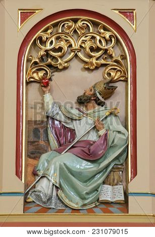 SISAK, CROATIA - DECEMBER 07: Saint Augustine of Hippo, Great Doctors of the Western Church, pulpit in the Church of Holy Cross in Sisak, Croatia, on December 07, 2017.