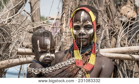 Omo Valley, Ethiopia, September 2017: Portrait Of Unidentified Karo Tribe Woman With Her Child, Colc