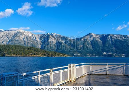 Fantastic view over ocean, snow mountain and rocks at Sechelt inlet in Vancouver, Canada.