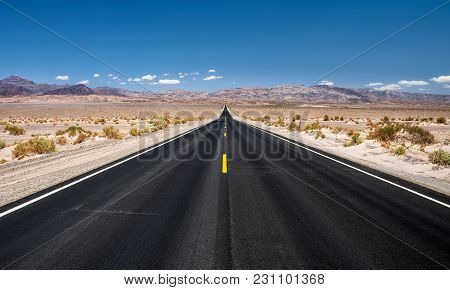 Long Empty Road Running Through Panamint Valley In Death Valley National Park, California