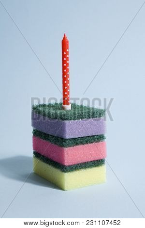A Pile Of Multicolored Sponges With A Candle Symbolizing A Piece Of Birthday Cake. Pop Minimal Color