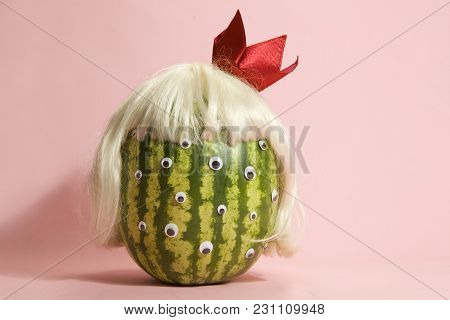 Freak Watermelon Wearing A Wig And Crown On A Pink Background
