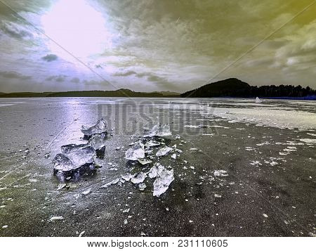 Shining Shards Of Broken Ice. Abstract Still Life Of Ice Floes On Lavel Of Frozen Lake.