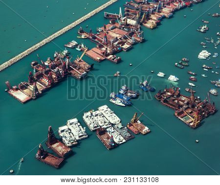 Hong Kong - October 2017: Elevated view of port with docking crane vessels. 