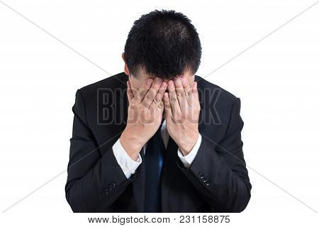 Businessman Under Stressed With A Headache Isolated On White Background. Disappointed Gloomy Young M