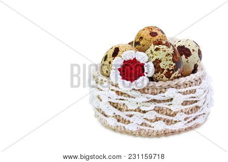 Linen Crochet Lace Basket With Easter Quial Eggs And Crochet Colorful Flower Isolated On White Backg