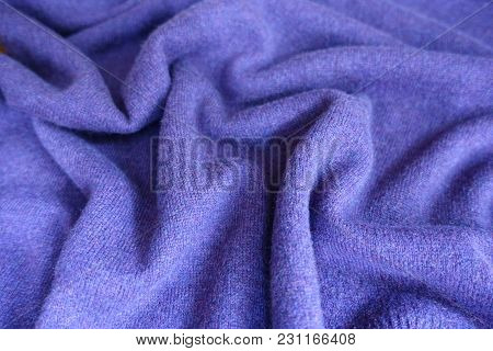 Soft Folds On Violet Woolen Jersey Fabric