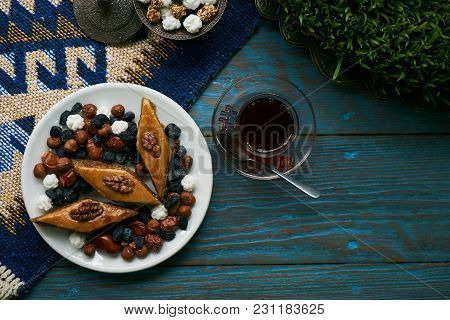 Azerbaijan National Pastry Pakhlava With Sweet Snack And Glass Of Traditional Black Tea On Wooden Ta