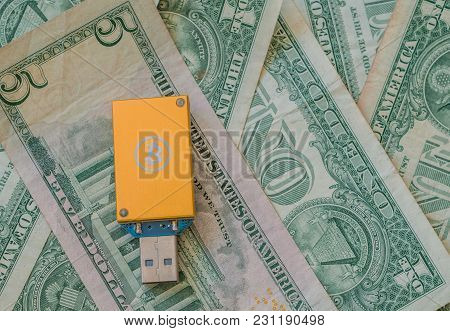 Gold Thumb Drive Usb Bitcoin Miner On Top Of Stack Of American Money
