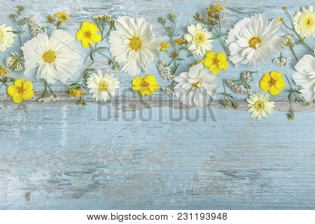 A Bouquet Of White Flowers Cosmea Or Cosmos With Ribbon On White Boards. Garden Yellow Flowers Over 