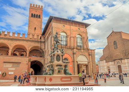 Bologna, Italy - March 12, 2018: Neptune 1500s Bronze Statue And Fountain With San Petronio Gothic B