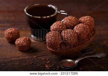 Chocolate Egg With Filling For Easter On Wooden Background