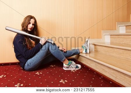 Portrait of attractive brown-haired woman indoors