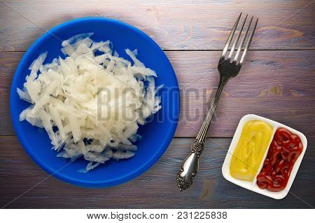 Daikon On A Wooden Background. Daikon On A Plate