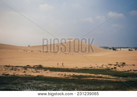 White Sand Dunes Muine In Vietnam With Tourists In The Summer