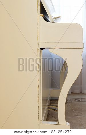 White Piano, Side View Of Instrument, Musical Instrument. Learn To Play The Instrument At Home. Whit