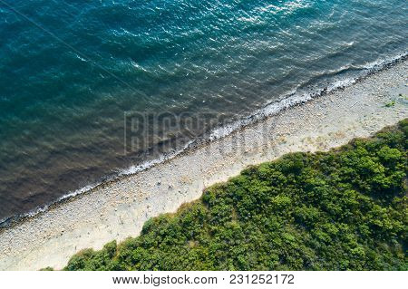 Aerial View Of Empty Seashore. Diadonal Line Of Surf.
