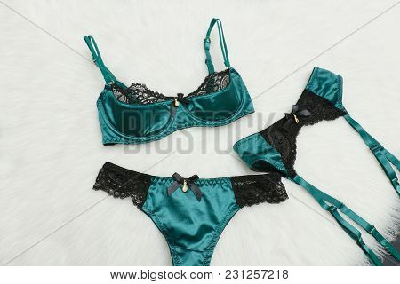 Emerald Set Of Underwear On White Fur. Fashion Background