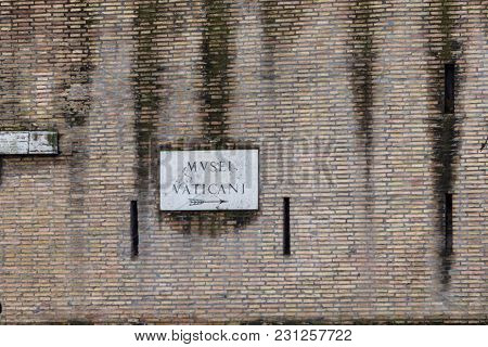 Horizontal Picture Of Bricky Wall Showing The Direction Of Vatican Museum In Vatican City, Italy