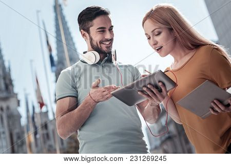 I Didnt Know That. Low Angle Shot Of A Surprised Millennial Woman Keeping Her Mouth Wide Opened Whil