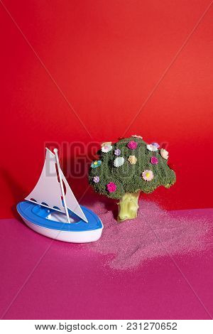 Pink Red Broccoli Flowers And Toy Boat