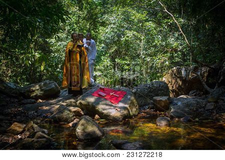 KOH CHANG, THAILAND - MAR 10, 2018: During Christian sacrament of spiritual birth - Baptism. There are currently 10 Orthodox parishes in Thailand, Orthodoxy is practiced by 0.002% of population.
