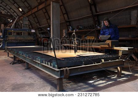 St. Petersburg, Russia - May 30, 2017: The Worker Stands At The Control Panel During Plasma Cutting 
