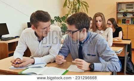 Students Study In The Classroom At The School Desk.