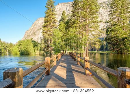 Merced River and Swinging Bridge landscape in Yosemite. California, USA.