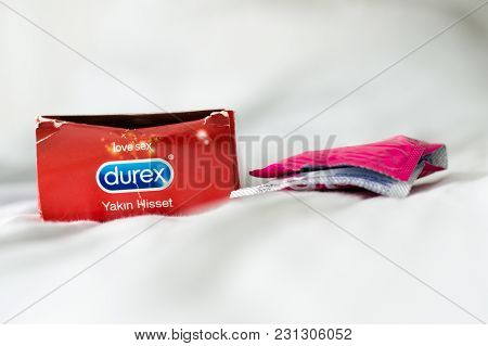 Didim, Turkey - September 30, 2017: Durex Condom And Opened Box On A Soft White Bed Sheet