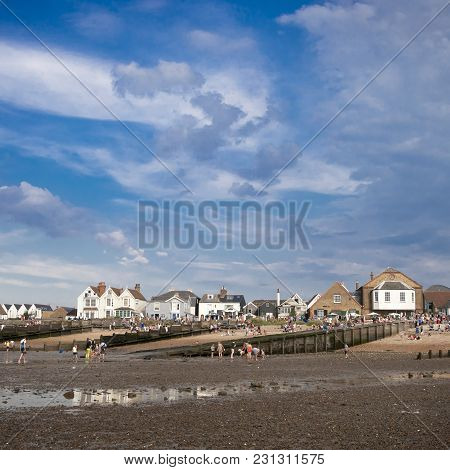 Whitstable, Uk - August 21 2014: People Are Looking For Crabs And Clams On The Sea Bed At Low Tide I