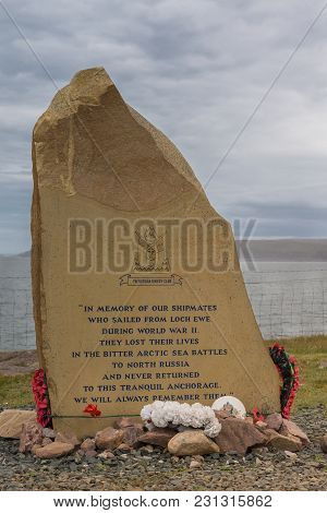 Inverasdale, Scotland - June 9, 2012: Closeup Of Memorial Rock-slab At Cove Light Anti Aircraft Batt