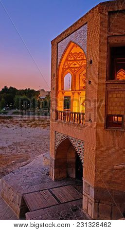 The Evening View From Khaju Bridge On Its Beautiful Portal With Scenic Arched Niches, Isfahan, Iran.