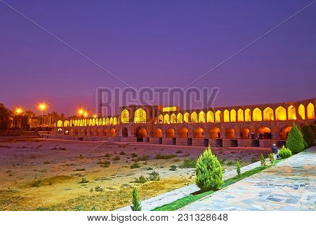 The Evening Walk In Moshtagh-e Aval Park, Stretching Along The Bank Of Zayandeh River, With A View O