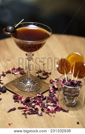 Dark Cocktail With Decorations On The Table