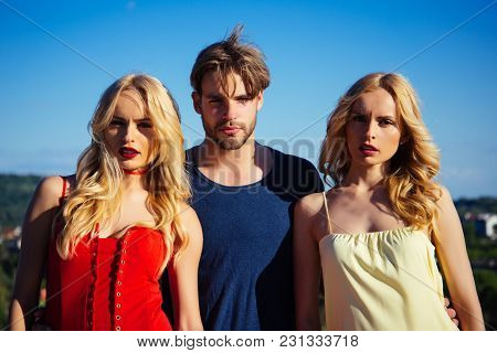 Twins Women With Macho On Blue Sky Background. Man With Beard With Twins, Relations. Family Trust, P