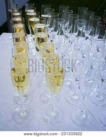 A Lot Of Glasses With Champagne On The Table