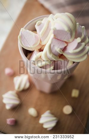 Marshmelow In A Nice Pink Glass On The  Table