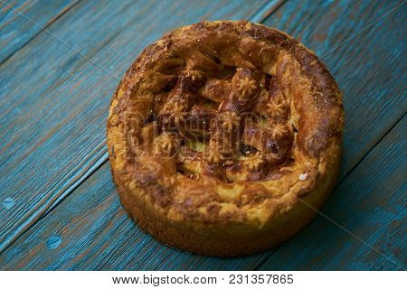Round Loaf Karavai On Wooden Rustic Table Background. Traditional Slavic Russian And Ukranian Festiv