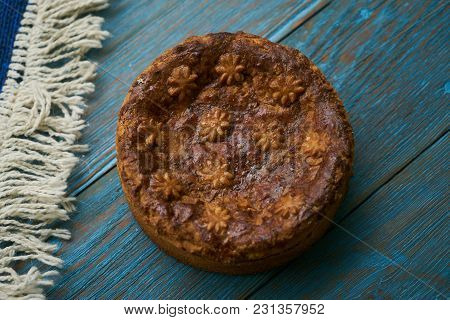 Round Loaf Karavai On Wooden Rustic Table Background. Traditional Slavic Russian And Ukranian Festiv